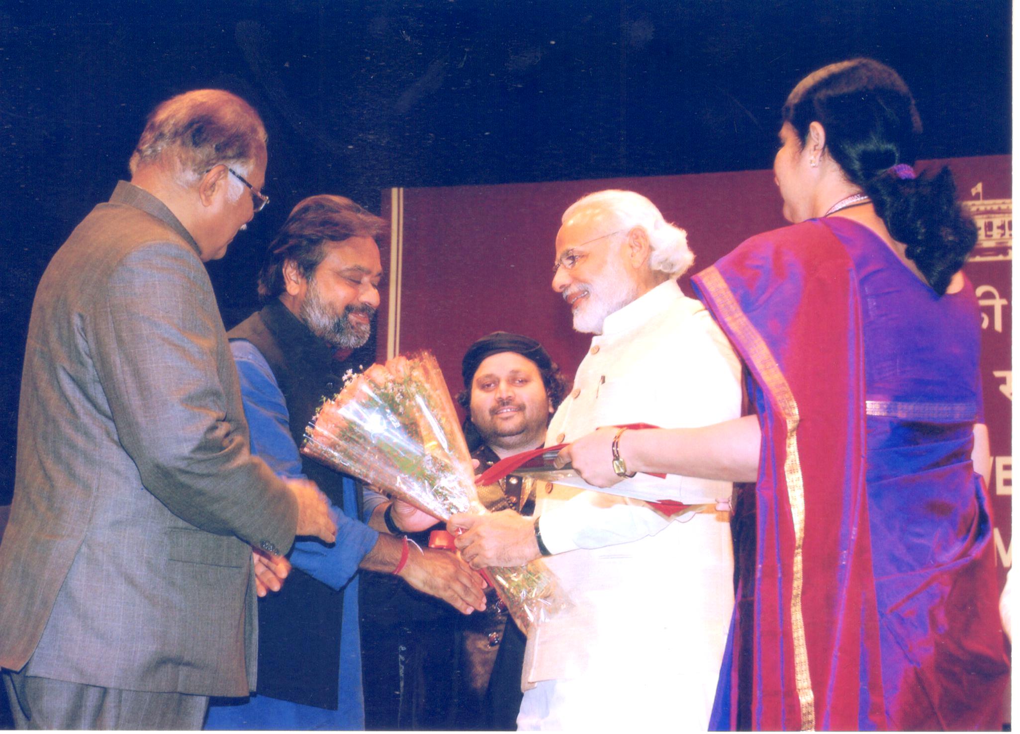 Sanjeev Bhargava with the Prime Minister Shri Narendra Modi at the Rajya Sabha Auditorium, 2015.