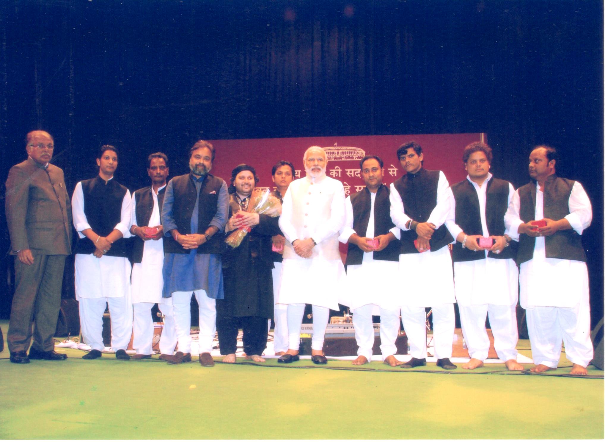Prime Minister Shri Narendra Modi with the famous Qawwal Ustad Chand Afzal Qadri and his Group at the Rajya Sabha Auditorium, 2015.